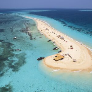 Boats around a serene sand island